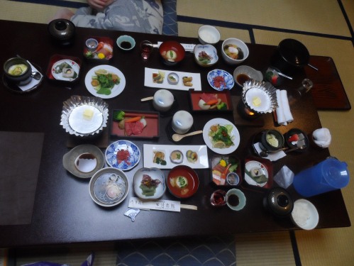 Our 16 course dinner all laid out at once. Being true flashpackers we BYO'd some cheap sake from the 7-11 to save some money